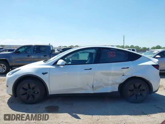 2024 Tesla Model Y with VIN 7SAYGDED0RA327806, listed as a IAAI auction lot 42096752 with 13,244 mi miles and . Bid and sale history available at DreamBid. Image 14.