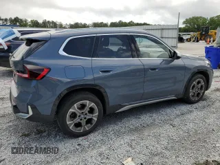 2023 BMW X1 xDrive28i with VIN WBX73EF08P5W51452, listed as a Copart auction lot 58420175 with 30,404 mi miles and Salvage title. Bid and sale history available at DreamBid. Image 3.