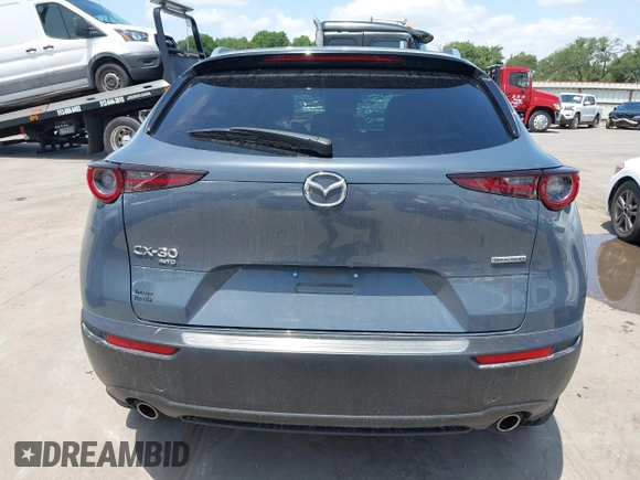 2022 Mazda CX-30 S Carbon Edition with VIN 3MVDMBCL6NM410330, listed as a IAAI auction lot 42107426 with 30,277 mi miles and . Bid and sale history available at DreamBid. Image 17.