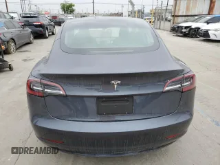 2023 Tesla Model 3 with VIN 5YJ3E1EA3PF697049, listed as a Copart auction lot 55601295 with 12,373 mi miles and Salvage Title. Bid and sale history available at DreamBid. Image 6.