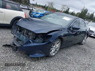 2015 Mazda 6 i Touring with VIN JM1GJ1V52F1185998, listed as a IAAI auction lot 41921373 with 101,306 mi miles and . Bid and sale history available at DreamBid. Image 2.