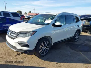 2017 Honda Pilot Touring with VIN 5FNYF6H93HB056387, listed as a IAAI auction lot 41095336 with 90,376 mi miles and . Bid and sale history available at DreamBid. Image 2.