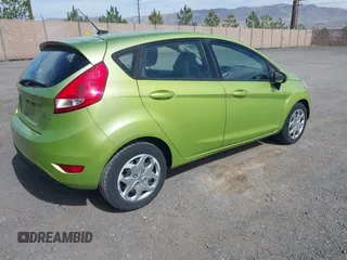 2011 Ford Fiesta SE with VIN 3FADP4EJ8BM157173, listed as a IAAI auction lot 41972892 with 407,227 mi miles. Bid and sale history available at carsss.com. Image 4.