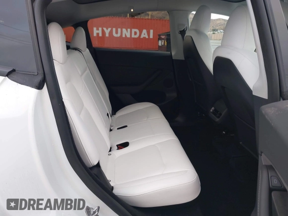 2023 Tesla Model Y Long Range with VIN 7SAYGDEE2PF874729, listed as a IAAI auction lot 41518376 with 10,927 mi miles and . Bid and sale history available at DreamBid. Image 8.