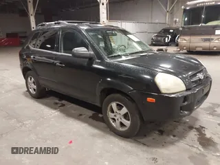 2006 Hyundai Tucson GL with VIN KM8JM12B26U325338, listed as a IAAI auction lot 41809578 with 127,210 mi miles. Bid and sale history available at carsss.com. Image 1.