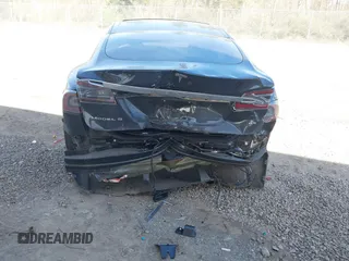 2014 Tesla Model S 60 z VIN 5YJSA1H19EFP45024, wystawiony jako IAAI lot #41960222 z przebiegiem 108 573 mil mil oraz . Historia ofert i sprzedaży dostępna na DreamBid. Obrazek 6.