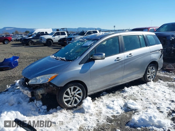 2014 Mazda 5 Sport with VIN JM1CW2BLXE0168119, listed as a IAAI auction lot 41527688 with 142,357 mi miles and . Bid and sale history available at DreamBid. Image 2.
