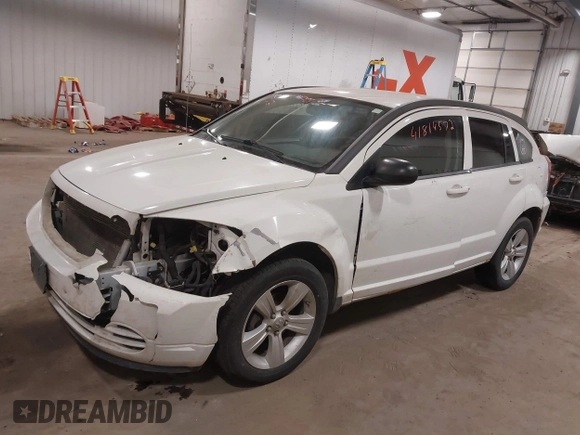 2010 Dodge Caliber SXT with VIN 1B3CB4HA3AD590654, listed as a IAAI auction lot 41814572 with 203,422 mi miles and . Bid and sale history available at DreamBid. Image 2.