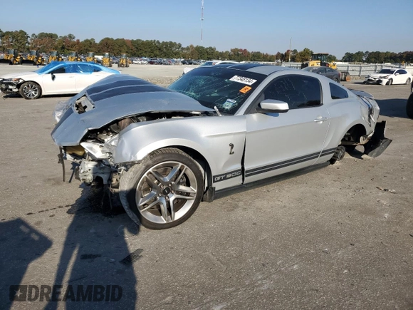 2010 Ford Mustang GT500 with VIN 1ZVBP8JS3A5156425, listed as a Copart auction lot 77348134 with 61,984 mi miles and Salvage title. Bid and sale history available at DreamBid. Image 1.