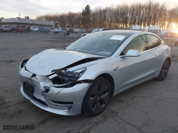 2018 Tesla Model 3 Long Range Battery with VIN 5YJ3E1EA8JF043008, listed as a IAAI auction lot 41002318 with 100,582 mi miles. Bid and sale history available at carsss.com. Image 19.