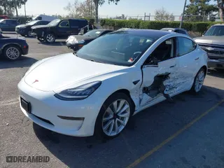 2018 Tesla Model 3 Long Range Battery with VIN 5YJ3E1EA0JF008351, listed as a IAAI auction lot 41129459 with 36,518 mi miles. Bid and sale history available at carsss.com. Image 2.