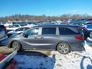 2023 Honda Odyssey Touring with VIN 5FNRL6H80PB005769, listed as a IAAI auction lot 41280858 with 7,041 mi miles and . Bid and sale history available at DreamBid. Image 14.