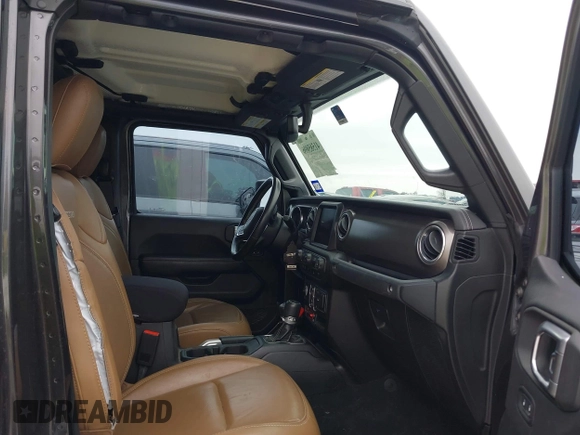 2020 Jeep Gladiator Rubicon with VIN 1C6JJTBG8LL135573, listed as a IAAI auction lot 41585896 with 79,070 mi miles and . Bid and sale history available at DreamBid. Image 5.