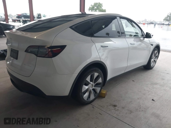2023 Tesla Model Y Long Range z VIN 7SAYGDEE2PF834036, wystawiony jako IAAI lot #41933120 z przebiegiem 27 872 mil mil oraz . Historia ofert i sprzedaży dostępna na DreamBid. Obrazek 4.