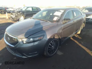 2014 Ford Taurus SHO with VIN 1FAHP2KT4EG140364, listed as a IAAI auction lot 35451709 with 82,904 mi miles. Bid and sale history available at carsss.com. Image 2.