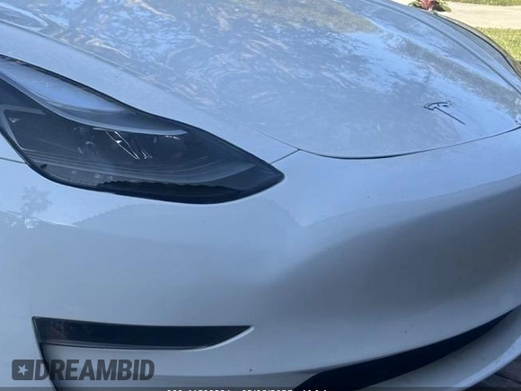 2023 Tesla Model 3 z VIN 5YJ3E1EA4PF555051, wystawiony jako IAAI lot #41500331 z przebiegiem 11 810 mil mil oraz . Historia ofert i sprzedaży dostępna na DreamBid. Obrazek 6.