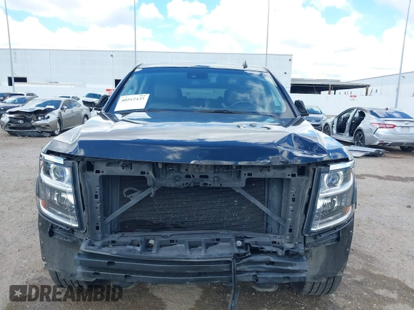 2015 Chevrolet Tahoe LT with VIN 1GNSCBKCXFR214072, listed as a IAAI auction lot 40512435 with 98,955 mi miles and . Bid and sale history available at DreamBid. Image 6.