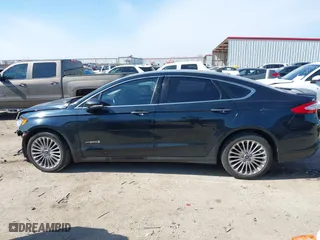 2014 Ford Fusion Titanium Hybrid with VIN 3FA6P0RU9ER111834, listed as a IAAI auction lot 41570337 with 121,099 mi miles. Bid and sale history available at carsss.com. Image 14.