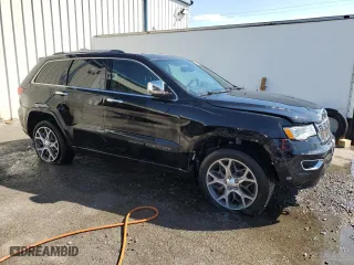 2019 Jeep Grand Cherokee Overland with VIN 1C4RJECG5KC602873, listed as a Copart auction lot 46701925 with 96,444 mi miles and Salvage Title. Bid and sale history available at carsss.com. Image 4.