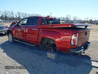 2015 GMC Canyon 4WD SLT z VIN 1GTG6CE38F1266466, wystawiony jako IAAI lot #41822501 z przebiegiem 26 479 mil mil oraz . Historia ofert i sprzedaży dostępna na DreamBid. Obrazek 3.
