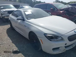 2015 BMW 6 Series 640i xDrive z VIN WBA6B8C59FD453073, wystawiony jako IAAI lot #41924061 z przebiegiem 81 421 mil mil oraz . Historia ofert i sprzedaży dostępna na DreamBid. Obrazek 1.