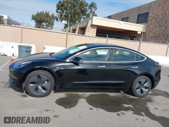 2019 Tesla Model 3 Mid Range with VIN 5YJ3E1EA2KF305834, listed as a IAAI auction lot 41719610 with 126,333 mi miles and . Bid and sale history available at DreamBid. Image 14.