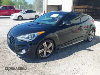 2013 Hyundai Veloster Turbo w/Black Int with VIN KMHTC6AE8DU175611, listed as a IAAI auction lot 42057549 with 137,929 mi miles. Bid and sale history available at carsss.com. Image 2.