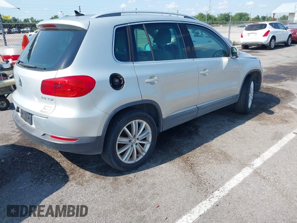 2012 Volkswagen Tiguan SE with VIN WVGAV7AX9CW581957, listed as a IAAI auction lot 42407148 with 135,553 mi miles and . Bid and sale history available at DreamBid. Image 4.