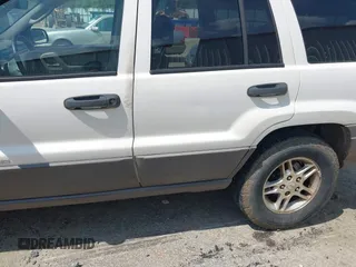 2003 Jeep Grand Cherokee Laredo z VIN 1J4GX48S33C519404, wystawiony jako IAAI lot #42164364 z przebiegiem 174 627 mil mil oraz . Historia ofert i sprzedaży dostępna na DreamBid. Obrazek 6.