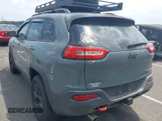 2015 Jeep Cherokee Trailhawk with VIN 1C4PJMBB0FW528421, listed as a IAAI auction lot 42591132 with 166,425 mi miles and . Bid and sale history available at DreamBid. Image 3.