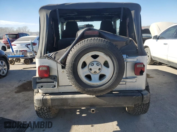 2003 Jeep Wrangler X with VIN 1J4FA39S63P304582, listed as a Copart auction lot 83576014 with 139,002 mi miles and Salvage title. Bid and sale history available at DreamBid. Image 6.