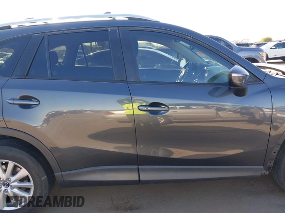 2016 Mazda CX-5 Touring with VIN JM3KE2CY4G0695947, listed as a IAAI auction lot 41824490 with 162,191 mi miles and . Bid and sale history available at carsss.com. Image 14.