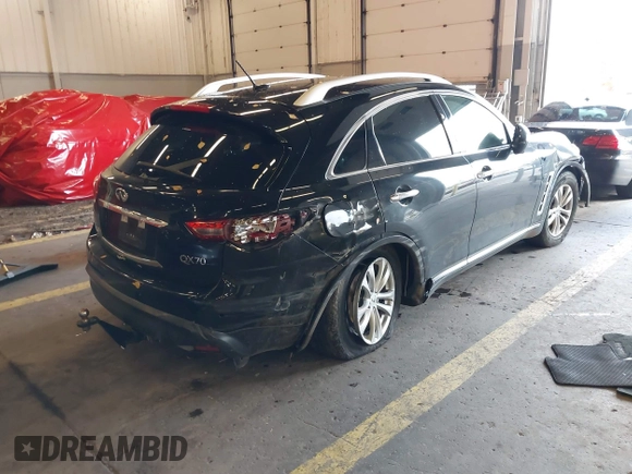2016 Infiniti QX70 z VIN JN8CS1MW7GM400558, wystawiony jako IAAI lot #40917829 z przebiegiem 149 885 mil mil oraz . Historia ofert i sprzedaży dostępna na DreamBid. Obrazek 4.