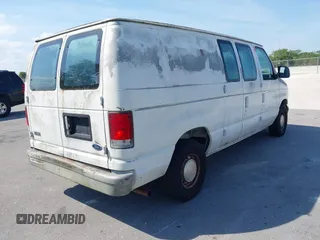 1999 Ford Econoline Cargo with VIN 1FTRE1428XHA20390, listed as a IAAI auction lot 41806875 with 207,954 mi miles. Bid and sale history available at carsss.com. Image 4.
