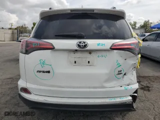 2018 Toyota RAV4 LE with VIN JTMBFREV9JD256759, listed as a Copart auction lot 51165835 with 128,253 mi miles and Salvage Title. Bid and sale history available at carsss.com. Image 6.