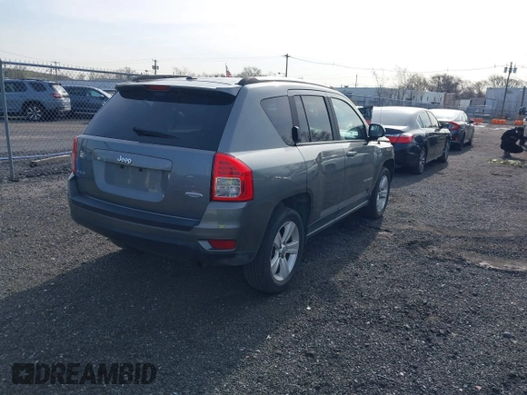 2013 Jeep Compass Latitude with VIN 1C4NJDEB7DD261645, listed as a IAAI auction lot 41948272 with 86,008 mi miles. Bid and sale history available at carsss.com. Image 4.