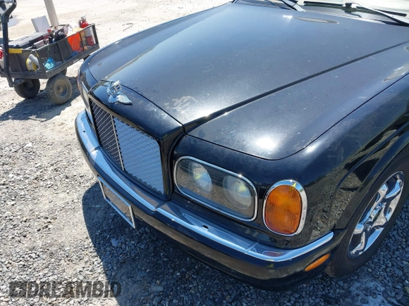 1999 Bentley Arnage z VIN SCBLB51E1XCX01401, wystawiony jako IAAI lot #42133144 z przebiegiem 29 699 mil mil oraz . Historia ofert i sprzedaży dostępna na DreamBid. Obrazek 6.