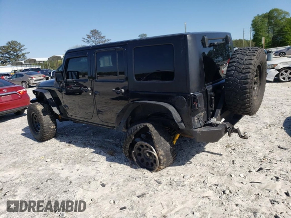 2013 Jeep Wrangler Unlimited Moab with VIN 1C4HJWEG7DL600043, listed as a Copart auction lot 52146945 with 118,882 mi miles and Salvage title. Bid and sale history available at DreamBid. Image 2.