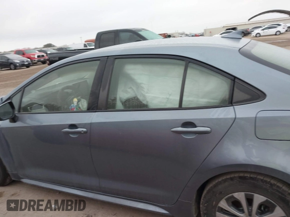 2021 Toyota Corolla Hybrid LE with VIN JTDEAMDE8MJ002711, listed as a IAAI auction lot 41498716 with 98,559 mi miles. Bid and sale history available at carsss.com. Image 13.