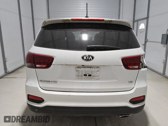 2019 Kia Sorento LX z VIN 5XYPG4A54KG482528, wystawiony jako Copart lot #55098735 z przebiegiem 128 821 mil mil oraz Czysty tytuł • Clean title. Historia ofert i sprzedaży dostępna na DreamBid. Obrazek 6.