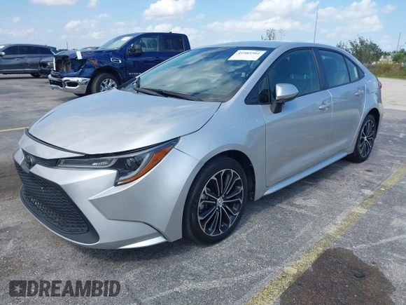 2020 Toyota Corolla LE with VIN JTDEPRAEXLJ023560, listed as a IAAI auction lot 41985501 with 59,529 mi miles. Bid and sale history available at carsss.com. Image 2.