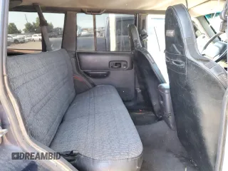 2000 Jeep Cherokee with VIN 1J4FF48S3YL126931, listed as a Copart auction lot 57593305 with Not provided miles and Non repairable. Bid and sale history available at DreamBid. Image 10.