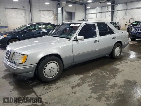 1995 Mercedes-Benz E 320 with VIN WDBEA32E2SC168493, listed as a Copart auction lot 82365704 with 102,066 mi miles and Salvage Title. Bid and sale history available at DreamBid. Image 1.