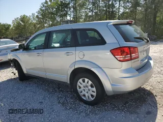 2013 Dodge Journey American Value with VIN 3C4PDCAB1DT715799, listed as a Copart auction lot 52404815 with 185,559 mi miles and Salvage Title. Bid and sale history available at DreamBid. Image 2.