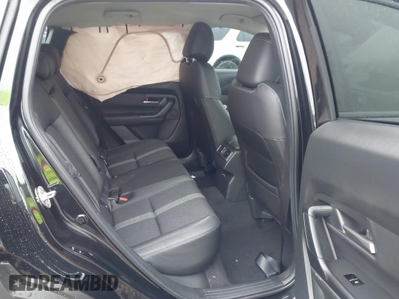 2024 Mazda CX-50 S Select with VIN 7MMVABAM9RN235769, listed as a IAAI auction lot 41183413 with 972 mi miles and . Bid and sale history available at DreamBid. Image 8.