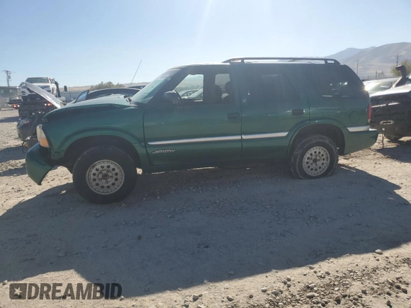 2000 GMC Jimmy SLE Convenience z VIN 1GKDT13W3Y2215035, wystawiony jako Copart lot #77484104 z przebiegiem 116 124 mil mil oraz Szkoda całkowita • Salvage title. Historia ofert i sprzedaży dostępna na DreamBid. Obrazek 1.