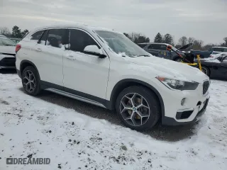 2019 BMW X1 xDrive28i with VIN WBXHT3C54K5L91407, listed as a Copart auction lot 84875904 with 97,304 mi miles and Salvage Title. Bid and sale history available at carsss.com. Image 4.