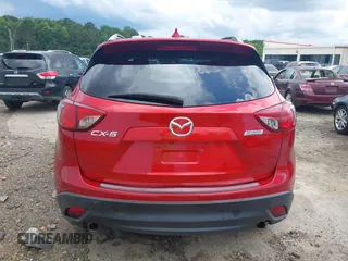 2016 Mazda CX-5 Grand Touring z VIN JM3KE2DY6G0693678, wystawiony jako IAAI lot #42443247 z przebiegiem 127 620 mil mil oraz . Historia ofert i sprzedaży dostępna na DreamBid. Obrazek 16.