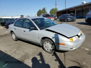 2001 Saturn SL z VIN 1G8ZH52891Z317279, wystawiony jako Copart lot #55163885 z przebiegiem 136 029 mil mil oraz Nie do naprawy • Non repairable. Historia ofert i sprzedaży dostępna na DreamBid. Obrazek 4.
