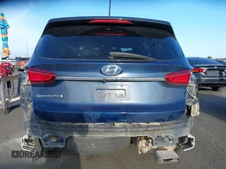 2019 Hyundai Santa Fe SE z VIN 5NMS23AD8KH096209, wystawiony jako IAAI lot #42235035 z przebiegiem 76 543 mil mil oraz . Historia ofert i sprzedaży dostępna na DreamBid. Obrazek 17.
